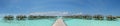 Beautiful panoramic photo of over water villas at the tropical island at Maldives Royalty Free Stock Photo