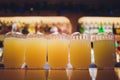 Beautiful vibrant picture of gold coloured beer glasses assortment, on wooden table, a summer sunny day, german Royalty Free Stock Photo