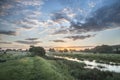 Beautiful vibrant Summer sunrise over English countryside landscape Royalty Free Stock Photo