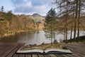 Beautiful vibrant sunrise landscape image of Blea Tarn in UK Lake District  coming out of pages in story book Royalty Free Stock Photo