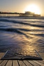 Beautiful vibrant sunrise landscape image of Worthing pier in West Sussex during Winter in pages of open book, story telling Royalty Free Stock Photo