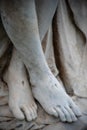 Close up of Jesus`s feet with stigmata Victorian cemetery statue