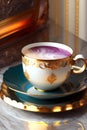 A beautiful Victorian style teacup with lace and gold details. Generative AI_11