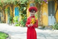 Beautiful Vietnamese woman with red ao dai celebrate lunar new year.