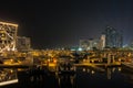 Beautiful view of Abu Dhabi city Etihad towers, famous landscape and Marina boats at night Royalty Free Stock Photo