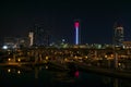 Beautiful view of Abu Dhabi city famous landscape displaying UAE flag, Etihad towers and Marina boats at night Royalty Free Stock Photo