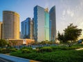 Beautiful view of Abu Dhabi city towers, buildings and parks at sunset from the corniche