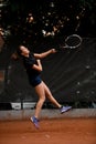 beautiful view of active sporty woman tennis player with tennis racket in hand doing pitch Royalty Free Stock Photo