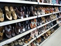 Beautiful view of Adult Slippers hanging in a Slipper Stand at the Vishal Market or Mall