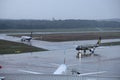 Beautiful view of airplanes on a runway in Cologne, Germany on a rainy day