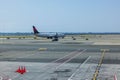 Beautiful view of airport runway with Delta airline plane getting ready for flight. USA.