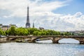 Beautiful view from Alexander III bridge with golden sculpture on Eiffel Tower and Seine River, Paris, France Royalty Free Stock Photo