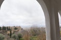 Beautiful view of alhambra palace from generalife gardens arc window Royalty Free Stock Photo