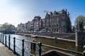 Beautiful view of Amsterdam canals with bridge and typical dutch houses. Holland Royalty Free Stock Photo