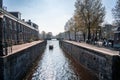 Beautiful view of Amsterdam canals with bridge and typical dutch houses. Holland Royalty Free Stock Photo