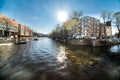 Beautiful view of Amsterdam canals with bridge and typical dutch houses. Holland Royalty Free Stock Photo