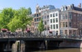 Beautiful view of Amsterdam canals with bridge and typical dutch houses. Holland Royalty Free Stock Photo