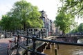 Beautiful view of Amsterdam canals with bridge and typical dutch houses. Holland Royalty Free Stock Photo