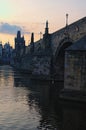 Beautiful view of ancient Charles Bridge over Vltava River during summer sunrise. Close-up photo Royalty Free Stock Photo