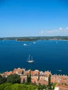 Beautiful view of the ancient city, the island and the sea on which the ship sails. Rovinj, Istria, Croatia. Aerial shot Royalty Free Stock Photo