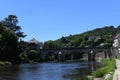 Beautiful view of the antique bridge downtown Montignac on a sunny day. Famous touristic place in Perigord, France.