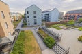 Beautiful view of architecture of modern residential buildings with recreation area on playground and parking for bicycles. Royalty Free Stock Photo