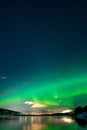 Beautiful view of the aurora, bright polar lights in the night sky.