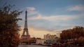 Beautiful view with Autumn tree fall at Eiffel Tower, iconic Paris landmark across the River Seine with  tourist boat  in  sunset Royalty Free Stock Photo