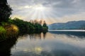 beautiful view on backwater of dam, under dramatic sky with sun rays Royalty Free Stock Photo