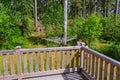 Beautiful view of backyard of private house with old wooden patio and collapsible outdoor clothes dryer view.