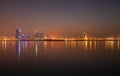 Beautiful illuminated Bahrain skyline with mist during sunset