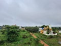 Beautiful view of Bangalore north village buildings and roads with nature background in a rainy season Royalty Free Stock Photo
