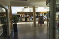 Beautiful view of bar area of hotel. Tourists sitting on high chairs , bar menu boards and decorations around. Oranjetad. Aruba.