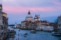 Beautiful view on Basilica di Santa Maria della Salute in golden evening light at sunset in Venice, Italy