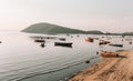 Beautiful view of a bay with fishing boats near a sandy shore Royalty Free Stock Photo