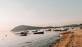 Beautiful view of a bay with fishing boats near a sandy shore Royalty Free Stock Photo