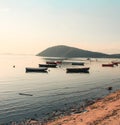 Beautiful view of a bay with fishing boats near a sandy shore Royalty Free Stock Photo