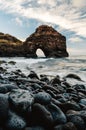 Beautiful view of beach with black sand and stones in North Tenerife coast at sunset. Atlantic ocean with strong waves and blue Royalty Free Stock Photo