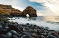 Beautiful view of beach with black sand and stones in North Tenerife coast at sunset. Atlantic ocean with strong waves and blue Royalty Free Stock Photo