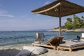 Beautiful view of beach in Greece with umbrella, sun beds and sea Royalty Free Stock Photo