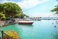 Beautiful view of the beach of the Italian city of Sirmione on lake Garda from the fortress on a Sunny summer day.