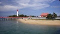 Beautiful view of the beach and pier and lighthouse at Tanjung Kalian.