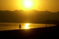 Beautiful view from beach to the orange daybreak sea Royalty Free Stock Photo