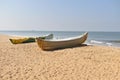 A Beautiful view of a Beach with two Fishing Boats on the Sea Shore on a Sunny Day Royalty Free Stock Photo