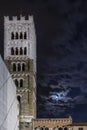 Beautiful view of the bell tower of the Duomo of San Martino with the moon and clouds in the night sky, Lucca, Tuscany, Italy Royalty Free Stock Photo