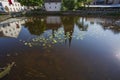 Beautiful view of beutiful white houses and cathedral church reflecting on the water surface. Royalty Free Stock Photo