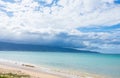 Beautiful view of big fluffy clouds in the clear blue sky over the beach on a summer day Royalty Free Stock Photo