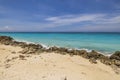 Beautiful view of big rocks protecting sandy coastline. Turquoise water of Atlantic ocean. Royalty Free Stock Photo