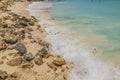 Beautiful view of big rocks protecting sandy coastline. Turquoise water of Caribbean sea. Royalty Free Stock Photo