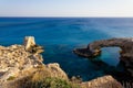 Beautiful view of the blue Mediterranean sea and the rock arch on a Sunny day from Cape Greco in Cyprus. Stone landscape of Ayia Royalty Free Stock Photo